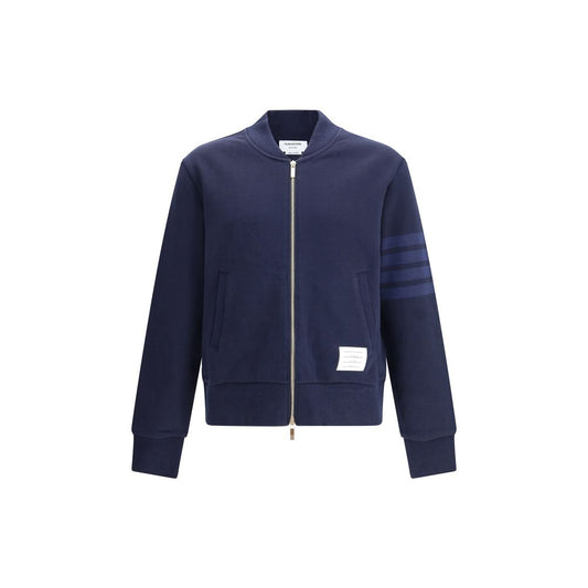 Thom Browne Zip Sweatshirt with front zipper, ribbed cuffs, logo patch, and iconic bands on sleeve, 100% cotton, navy blue.