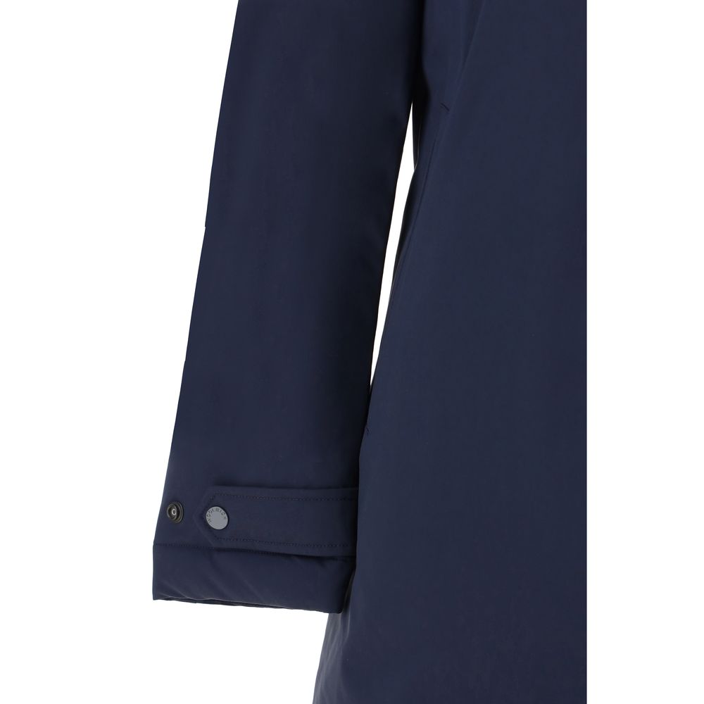 Sleeve detail of Woolrich Carcoat Down Jacket with adjustable button cuff, quilted design, and monochrome pattern.